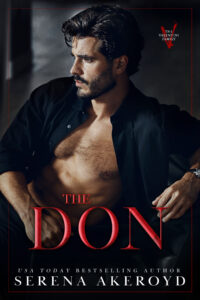 A handsome man in his 30s with dark brown hair and a tightly cropped beard wears a black shirt. The shirt is unbuttoned, showing the mans chest. He is sitting in a relaxed position, slightly leaning backwards. Text reads: The Don - USA Today Bestselling Author Serena Akeroyd