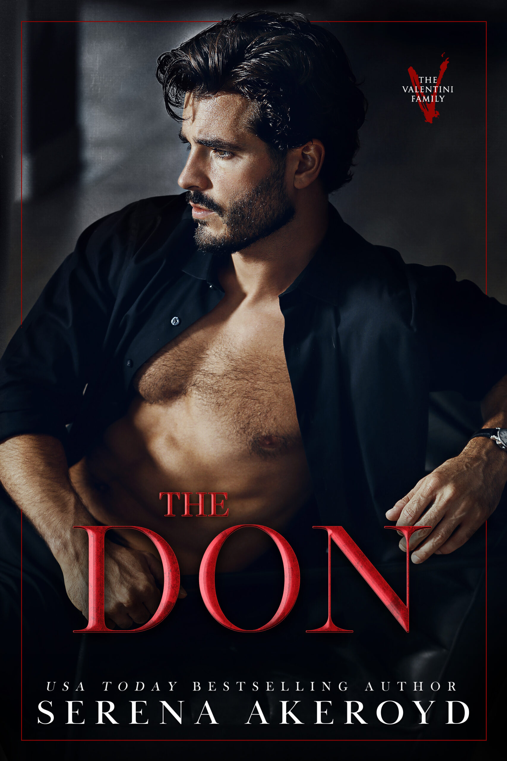 A handsome man in his 30s with dark brown hair and a tightly cropped beard wears a black shirt. The shirt is unbuttoned, showing the mans chest. He is sitting in a relaxed position, slightly leaning backwards. Text reads: The Don - USA Today Bestselling Author Serena Akeroyd
