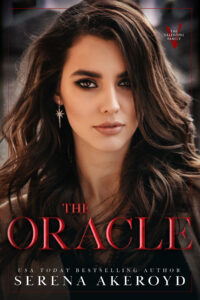 A woman with chestnut brown hair has long hair that falls in waves over her shoulders. Her makeup features a smoky eye with a neutral lip. She is wearing dangly earrings that show an eight pointed star. Text reads: The Oracle - USA Today Bestselling Author Serena Akeroyd