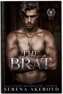 The cover of The Brat featuring a chiseled man with light brown hair. He's shirtless and standing with his arms crossed. Text reads: The Brat, USA Today Bestselling Author Serena Akeroyd