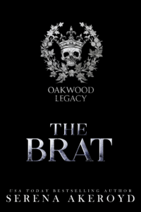 A skull wearing a crown and surrounded by laurels with Oakwood Legacy underneath is at the top of the image in a pewter-like color. Below that is the book title The Brat in a distressed silver font. At the bottom, text reads: USA Today Bestselling Author Serena Akeroyd